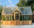 Front view of Cedar Rustic T-Garden Cross Greenhouse featuring elegant cedar wood finish and T-shaped design