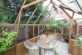 Interior close-up showcasing spacious gardening area inside Cedar Rustic T-Garden Cross Greenhouse.
